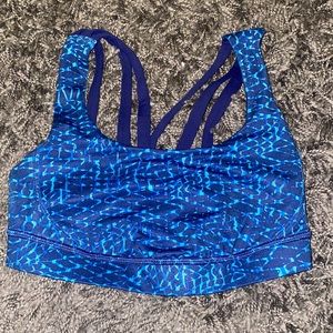 Lululemon sports bra *size unknown, but measurements listed*. Around XS/S